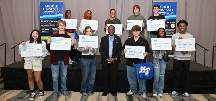 Eleven of 13 scholarship recipients from the Chattanooga, Tenn., area are shown with Middle Tennessee State University President Sidney A. McPhee, front row center, on Tuesday, Oct. 22, during the MTSU True Blue Tour visit at The Chattanoogan Hotel. (MTSU photo by James Cessna)