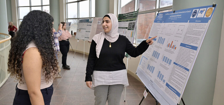 Middle Tennessee State University student researcher presents her research project on the effects of antibiotic and oxytocin interactions to an attendee at the seventh annual Undergraduate Research Center Fall Research and Creative Activity Open House held Thursday, Nov. 7, in the Miller Education Center on campus in Murfreesboro, Tenn. (MTSU photo by Andy Heidt)