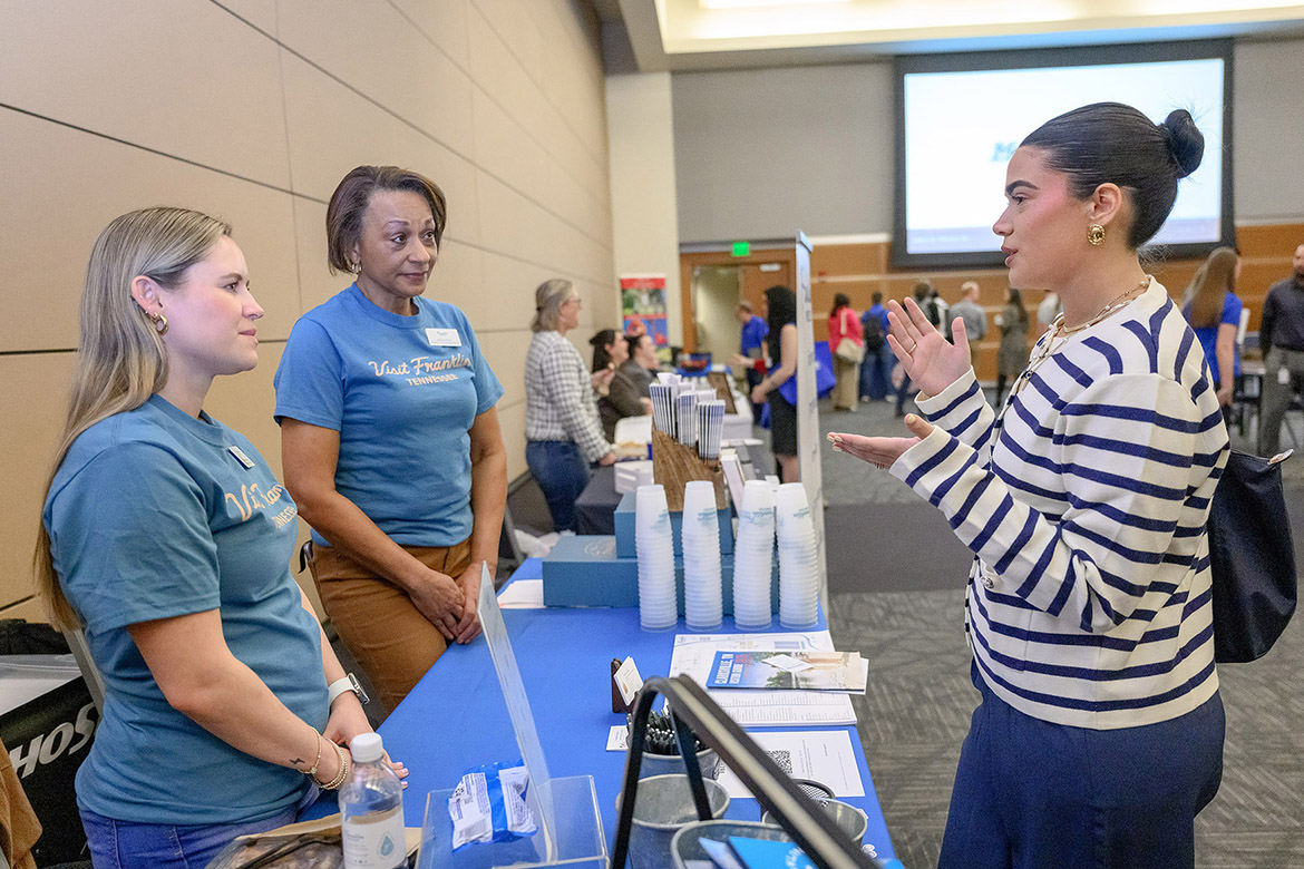 Elizabeth Donaghey of Murfreesboro, right, a tourism and hospitality management student at Middle Tennessee State University in Murfreesboro, Tenn., talks with Visit Franklin representatives Natali Erickson, left, and Felecia West, center, on Tuesday, Feb. 25, at the Tourism and Hospitality/Leisure and Sport Management Career Fair held in the Student Union Ballroom on campus. Nearly 30 vendors from companies across the region were on hand to recruit students for employment. (MTSU photo by J. Intintoli)