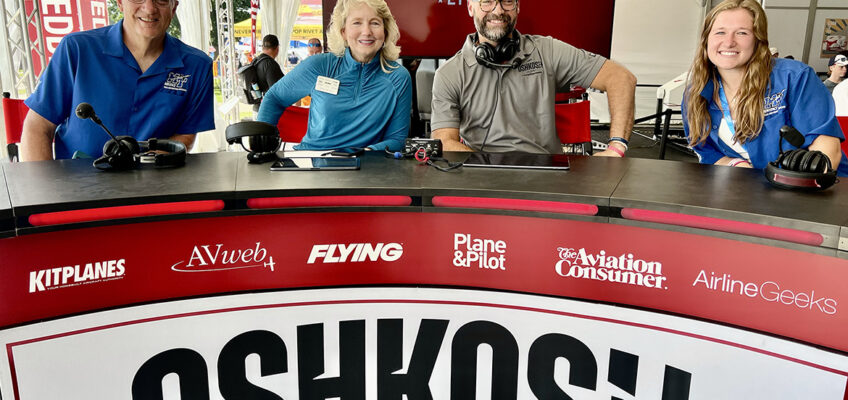 Mark Byrnes, left, provost of Middle Tennessee State University in Murfreesboro, Tenn., is joined by MTSU Aerospace Department alumna and current flight instructor Hailey Harrison, right, for a broadcast of the Oshkosh Live livestreamed TV program during the 72nd EAA AirVenture aviation showcase held July 21-27 in Oshkosh, Wis. Interviewing them are co-hosts Teresa de Mers, center left, and Shawn Bean, center right. (MTSU photo by Andrew Oppmann)