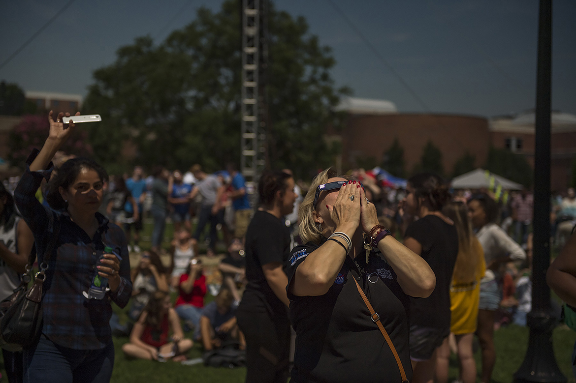 MTSU staff member Pat Thomas reacts as the moon nearly covers the sun and approaches the total eclipse stage at the Great Tennessee Eclipse Aug. 21 on the MTSU campus. (MTSU photo by Kimi Conro)