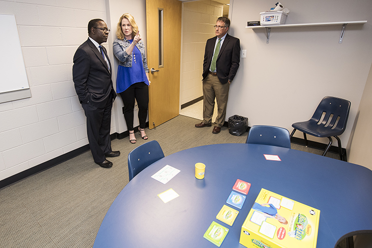 At left, MTSU President Sidney A. McPhee, and University Provost Mark Byrnes, right, get a tour of one of the rooms in the new Speech-Language-Hearing Clinic location inside Alumni Memorial Gym from Elizabeth Smith, clinic coordinator. (MTSU photo by Andy Heidt)