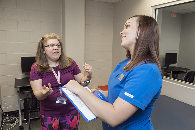 Student clinician Brandie White, right, works with client Kayla Capps at the MTSU Speech-Language Hearing Clinic. The facility, now in its 50th year, is celebrating with a move to new offices on the first floor of the Alumni Memorial Gym. (MTSU photo by Andy Heidt)