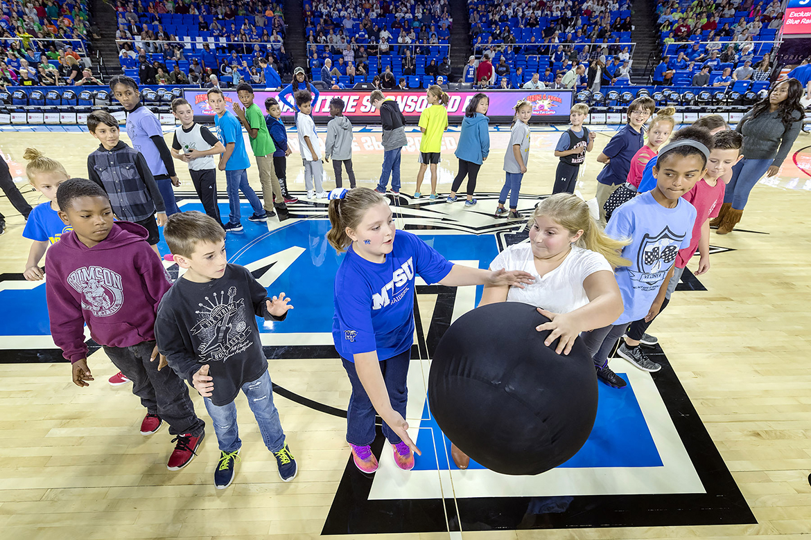 A musical chairs-type game with no chairs and a big rubber ball was part of halftime activities.