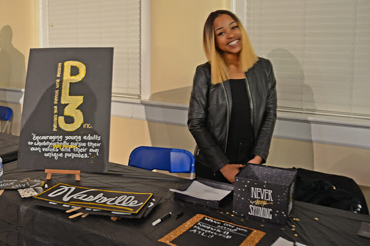 MTSU senior Tranae Chatman, founder of the nonprofit, Pursuing Your Purpose with Passion, or P-3, stands at her display table during the Feb. 1 “Initiative” event hosted by Delta Sigma Theta Sorority in the Tom Jackson Building. (MTSU photo by Jayla Jackson)