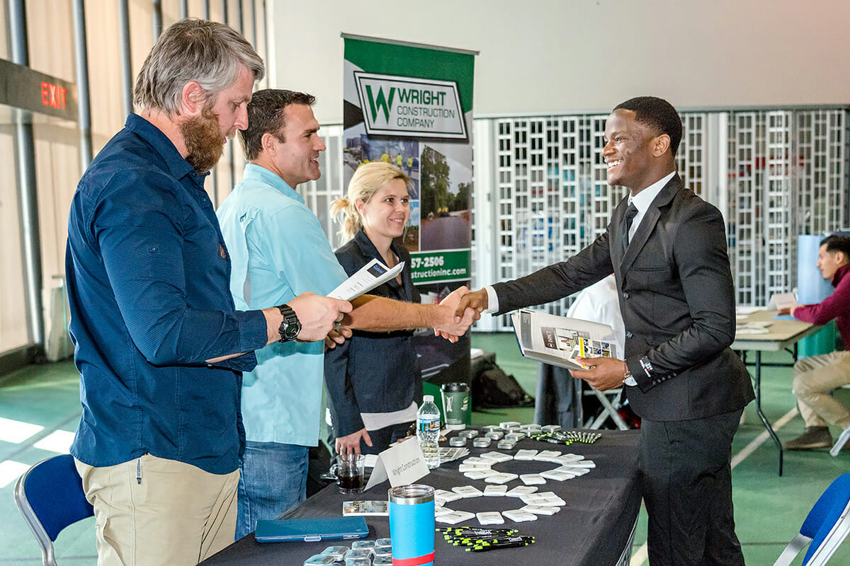 Wright Construction representatives thank Gabriel Banda for his interest in a summer internship.