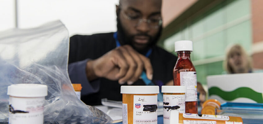 A fourth-year Lipscomb pharmacy students assists during MTSU Drug Take-Back Day.