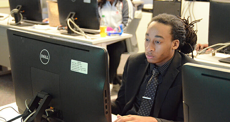 MTSU senior Zeckary Smith, an integrated studies major, works on his LinkedIn profile during an April 19 workshop in the Business and Aerospace Building. (MTSU photo by Jayla Jackson)