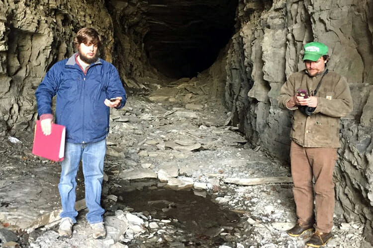 Graduate research assistant Harris Abernathy, right, and local resident Chase Stapler explore an abandoned railroad tunnel in Giles County as part of an MTSU Center for Historic Preservation Professional Services Partnership. (Photo courtesy of the Center for Historic Preservation)
