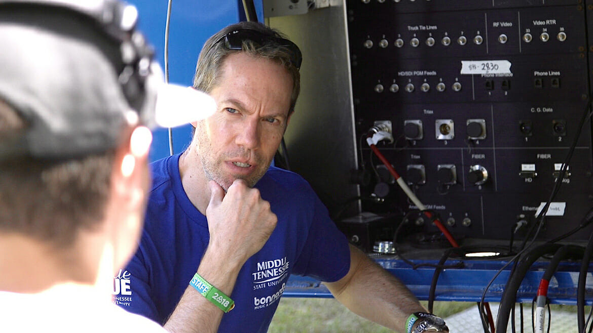 Michael Fleming, a professor in MTSU’s Department of Recording Industry who teaches audio engineering, goes over procedures Saturday, June 9, with students from the College of Media and Entertainment who are capturing audio from the Who Stage at the 2018 Bonnaroo Music and Arts Festival in Manchester, Tenn. (MTSU photo by Rob Janson)