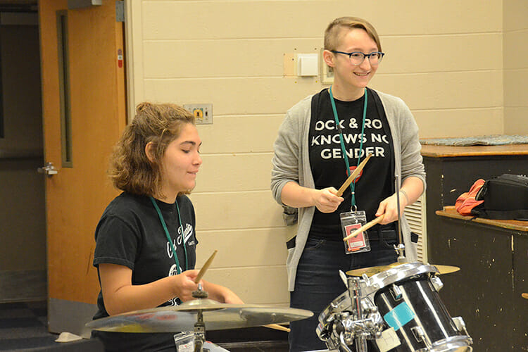 Southern Girls Rock Camp teaching assistant Anna Murphree instructs camper Shelby Asbury, 15, on the drums inside Wright Music Building during the weeklong camp at Middle Tennessee State University. (MTSU photo by K. Simpson)