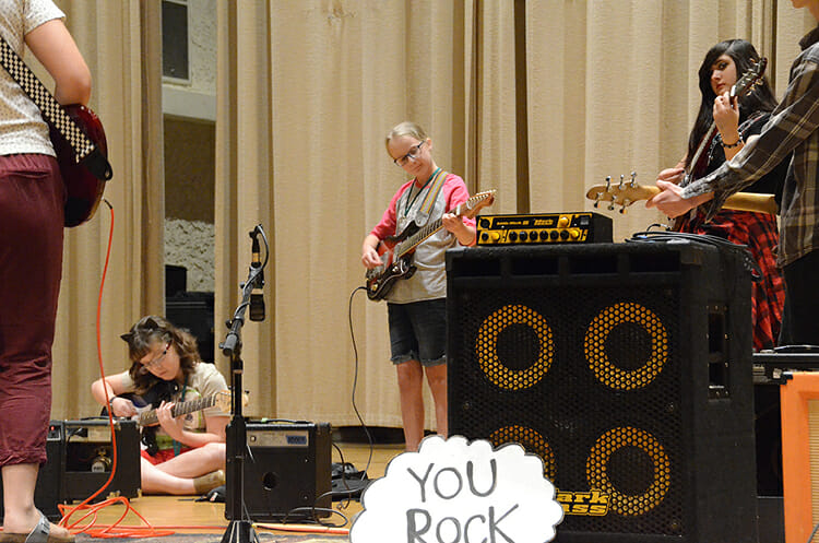 A group of attendees at this week’s Southern Girls Rock Camp tune their instruments on the stage inside the Wright Music Building. In its 16th year, the camp was held July 23-28 at Middle Tennessee State University. (MTSU photo by K. Simpson)