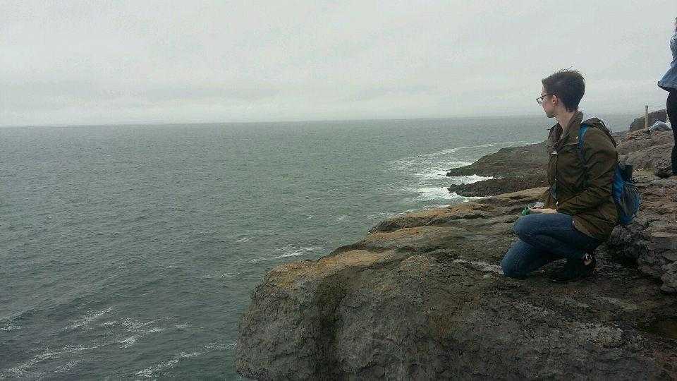 MTSU student Angele Latham looking over the water from a cliff during her Study Abroad trip to Ireland.