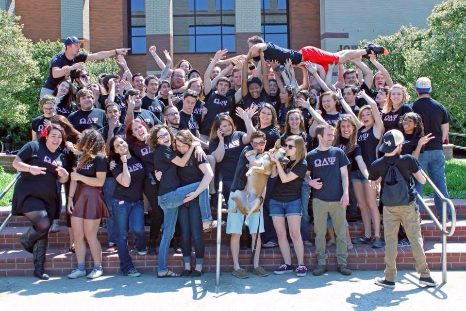 Members of Omega Delta Psi in front of the Bragg Media and Entertainment Building.
