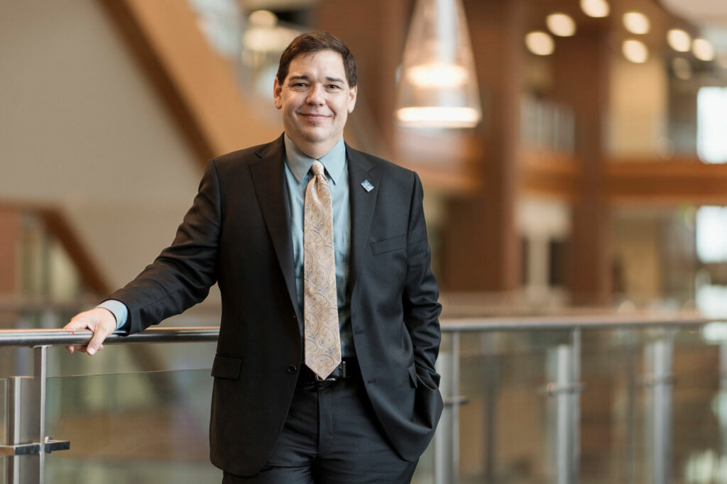 Environmental portrait of Dr. David Butler, dean of MTSU College of Graduate Studies, standing on the second floor of the Student Union Building. Photo by Eric Sutton.