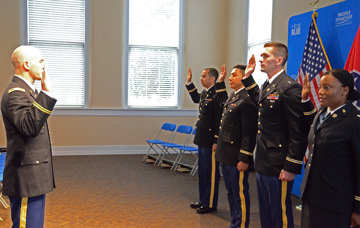 MTSU recent graduates take the Army oath as they are commissioned.
