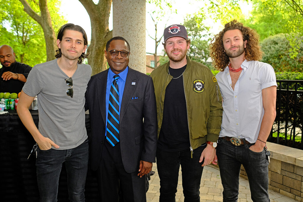 MTSU President Sidney A. McPhee, second from left, poses with university alumni Chandler Baldwin, left, Jared Hampton and Eric Steedly, who are members of the award-winning country music group Lanco. McPhee, on behalf of the university, presented the trio with certificates for their accomplishments and excellence in artistic expression on Wednesday, April 17, at BMI in Nashville, Tenn. (MTSU photo by David Foster)