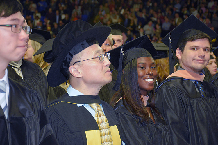 Students ponder their futures and smile for photographers in this file photo from the university’s fall 2018 commencement ceremonies in Murphy Center. MTSU will present 2,535 degrees — 394 graduate and 2,141 undergraduate — to spring 2019 graduating students during a two-day commencement event May 3 and 4. (MTSU file photo by GradImages.com)