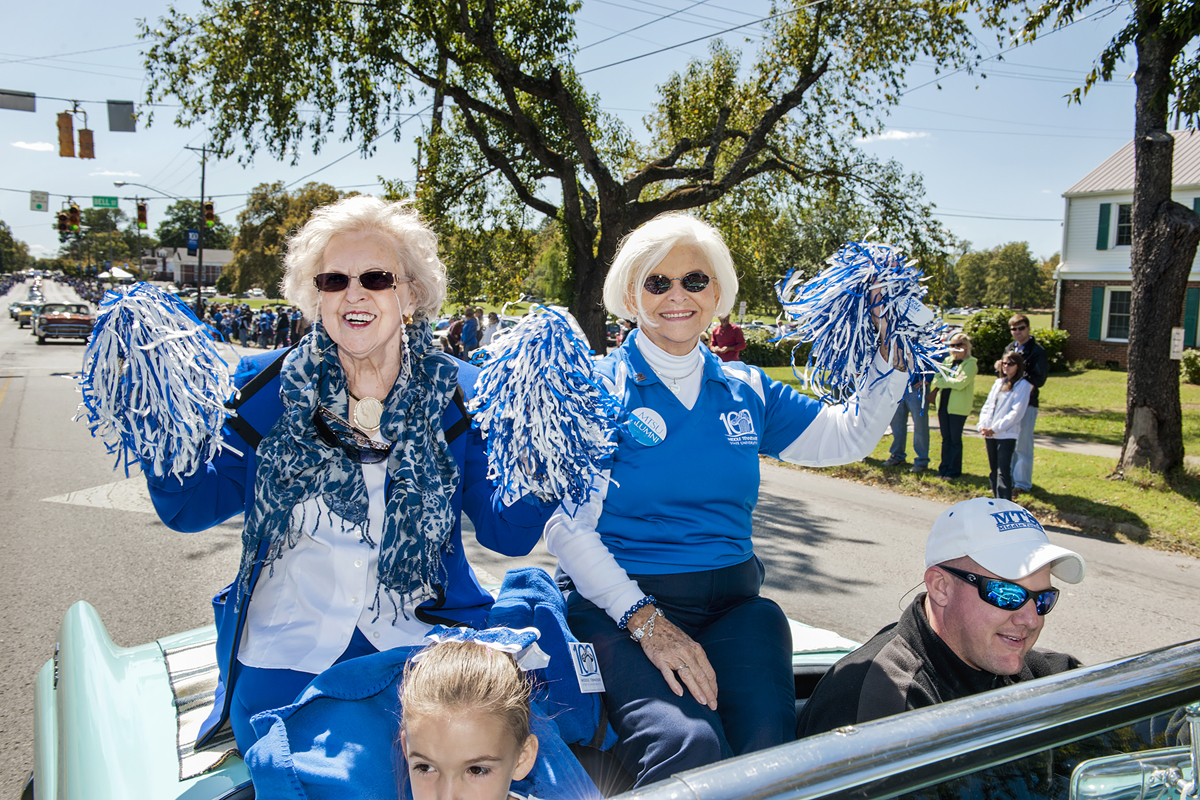 Alumnae Liz Rhea, left, and Hanna Witherspoon sit atop a convertable that’s part of the October 2011 MTSU Homecoming Parade traveling down Middle Tennessee Boulevard. Rhea, a 1955 graduate, died Thursday, May 30. (MTSU file photo by J. Intintoli)