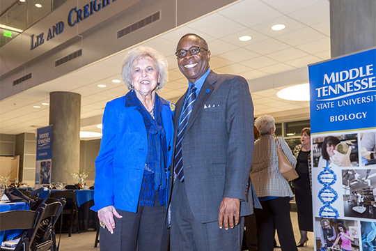One of MTSU’s most loyal alumni, Dr. Liz Rhea proudly displays hwe “I AM true BLUE” sign during a university Capital Campaign luncheon. The Murfreesboro resident and Eagleville, Tenn., native died Thursday, May 30. (MTSU file photo by Andy Heidt)