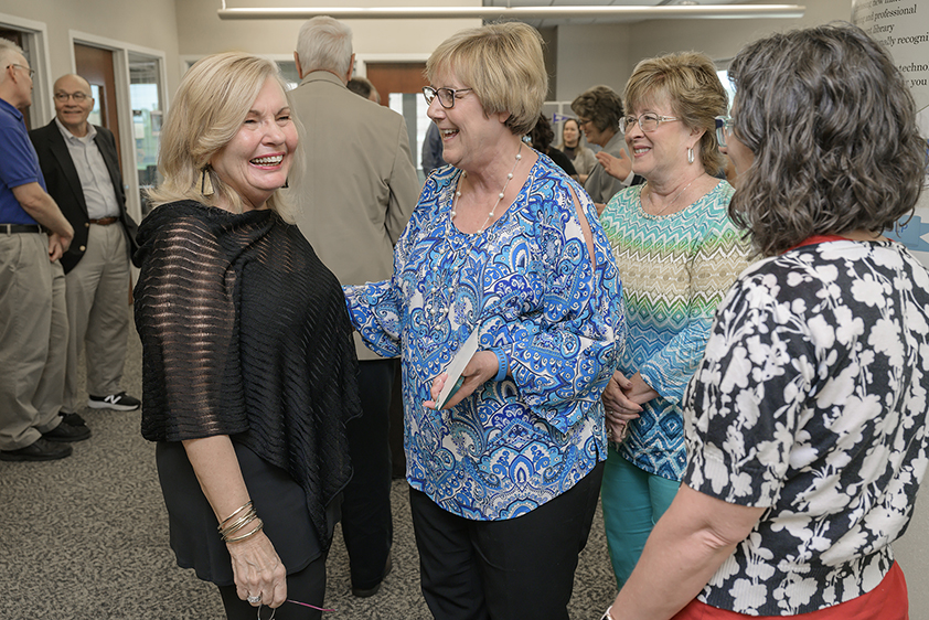 From left, Lucinda Taylor Lea, vice president emeritus of MTSU’s Information Technology Division, chats with Debbie Warren, ITD systems analyst; Joann Batson, ITD systems analyst; and Janae Peterson, ITD systems analyst, on June 17 at the dedication ceremony for the Lucinda Taylor Lea Learning, Teaching and Innovative Technologies Center. The center is located on the third floor of the James E. Walker Library. (MTSU photo by Andy Heidt)