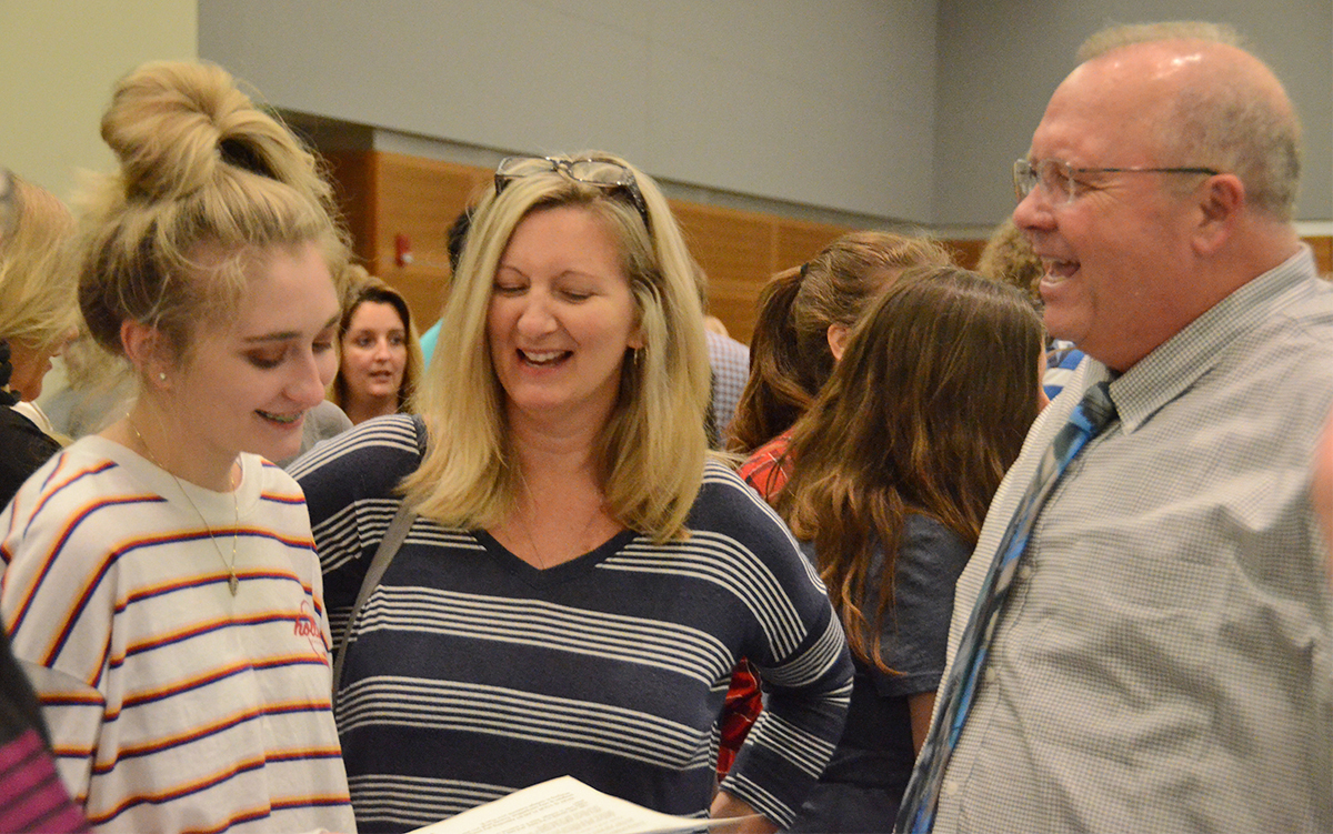 MTSU College of Basic and Applied Sciences Dean Bud Fischer, right, laughs along with a prospective student and her mother while discussing science opportunities in August 2018 during the annual Rutherford County College Night at MTSU. This year’s event, which is free, is from 6 to 8 p.m. Wednesday, Sept. 4, in the Student Union Ballroom, with 50 colleges and universities participating. (MTSU file photo by Randy Weiler)