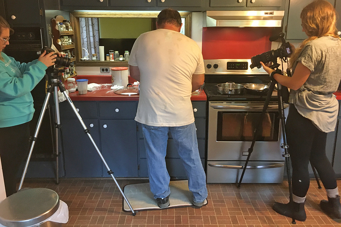 MTSU junior journalism major Christyn Allen of Robbins, Tenn., left, films organic farmer Kevin Guyer for a story at the recent Lens Collective 2019 multimedia storytelling workshop in Mississippi. At right is Allen’s student partner, Alie Skowronski from Ohio University. (Submitted photo)