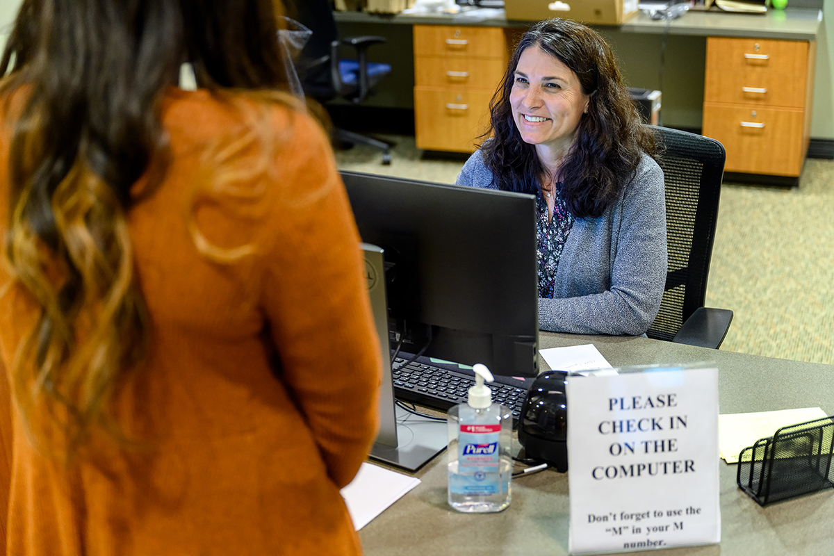 Kristy Carter, right, a secretary in MTSU Student Health Services, assists with the check-in of a student seeking care at the clinic Tuesday, March 17. The clinic is open from 8 a.m. to 4:30 p.m., with after-hours nursing assistance available by calling 615-898-2988. (MTSU photo by J. Intintoli)