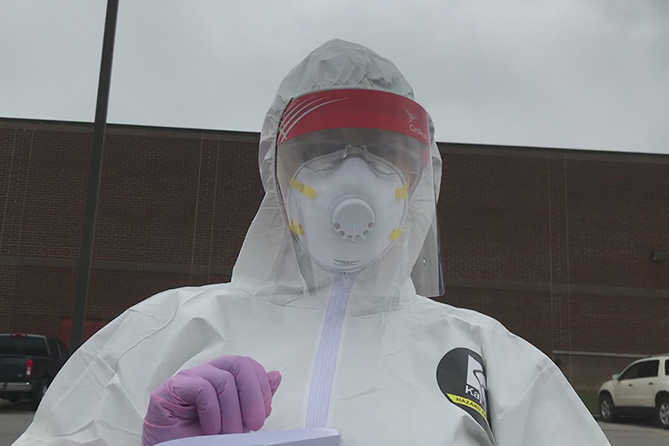 This young woman, clad in full protective equipment, including an N95 mask and face shield, administered the COVID-19 test to MTSU employee Gina Logue in Shelbyville, Tenn., April 18. (Photo submitted)