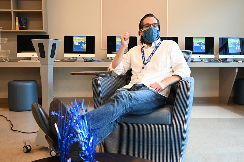 Dr. Lando Carter, assistant professor of education at Middle Tennessee State University, sits on one of the new chairs in the College of Education’s HUB workspace designated for teacher candidates on Sept. 23, 2020. (MTSU photo by Stephanie Barrette)