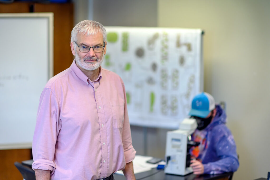 Dennis Mullen, Honors Biology faculty portrait in the Honors Science Lab.