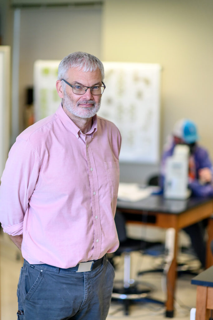 Dennis Mullen, Honors Biology faculty portrait in the Honors Science Lab.