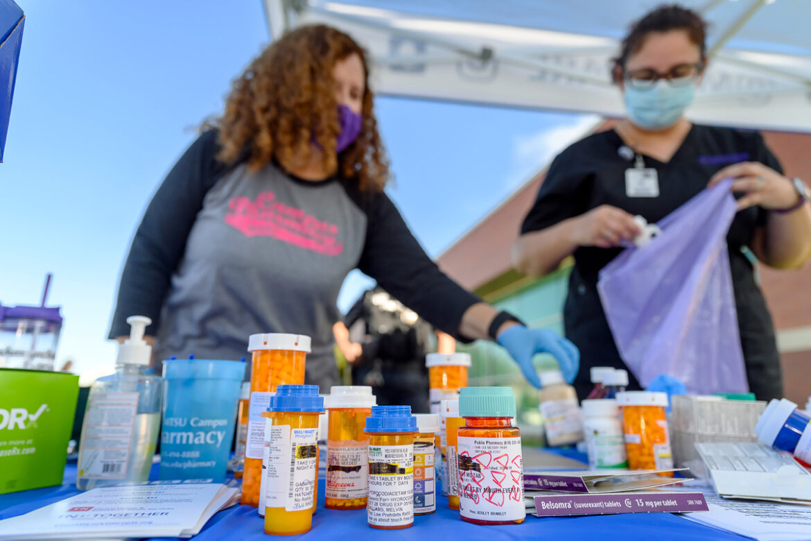 MTSU pharmacist Tabby Ragland, left, and Shanna Messex, a second-year Lipscomb University College of Pharmacy student at the time, collect and count unwanted medications dropped off in October 2020, during the semiannual MTSU Drug Take-Back Day. The drive collected nearly 70 pounds. (MTSU photo by J. Intintoli)