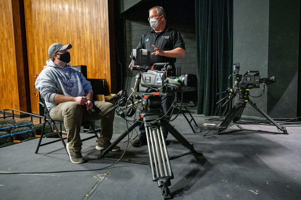MTSU Department of Media Arts professor Robert "Bob" Gordon Jr. standing, talks with junior J.J. Blanton on the stage of Tucker Theatre as his students prepare to record the MTSU Dance Theatre's 2020 Fall Dance Concert for broadcast Saturday, Nov. 21. (MTSU photo by Andy Heidt)