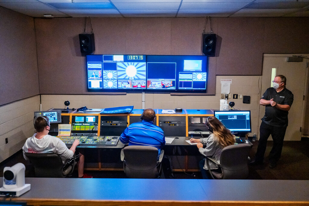 MTSU Department of Media Arts students produce one of six episodes of their game show "Don't @ Me" in Studio 1 of the Bragg Media and Entertainment Building as professor Robert "Bob" Gordon Jr., right, looks on. From left are students Walker Oakes, Ryan Tyler and Jordyn Lee, and Gordon. (MTSU photo by Andy Heidt)