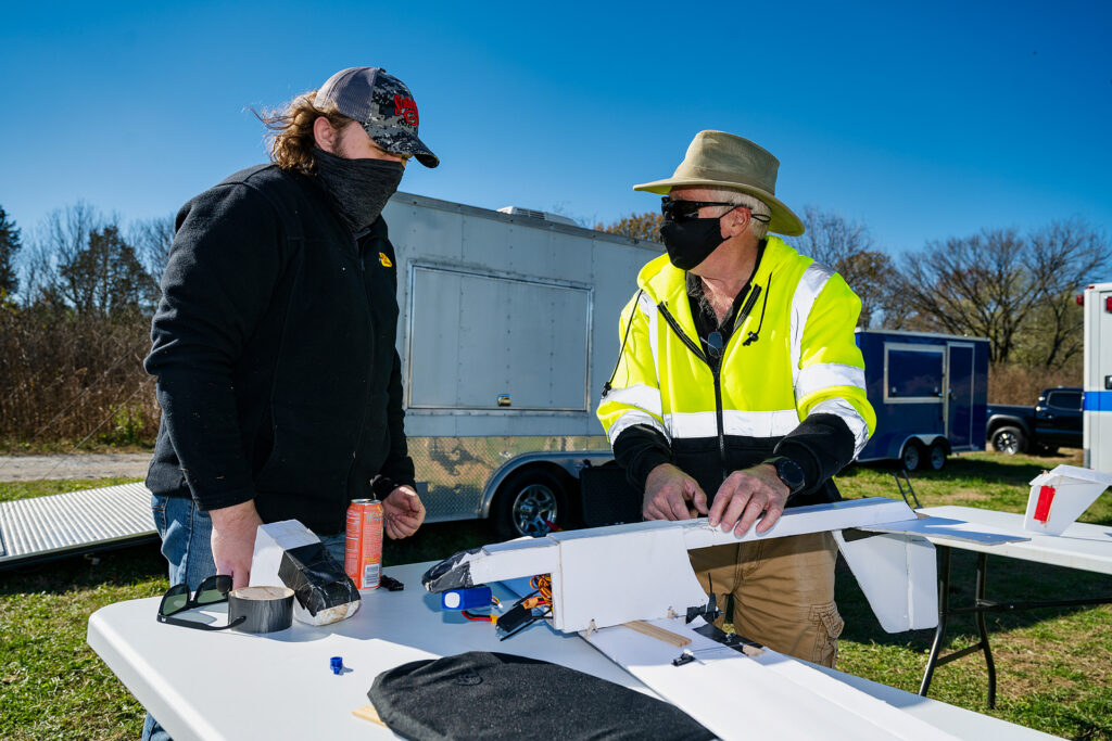 Kevin Corns, Aerospace faculty, with students flying their Unmanned Aerial System aircraft at the MTSU Farm. Brian Liddle (Jr.) left, with Kevin Corns, Aerospace faculty. (Photo: Andy Heidt)