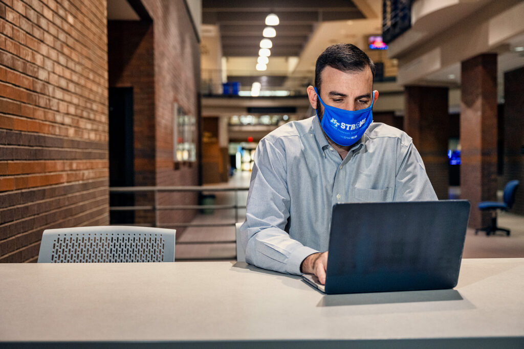 Matthew Taylor, Journalism and Strategic Media faculty, in and around the Bragg Media and Entertainment Building. (Photo: Andy Heidt)
