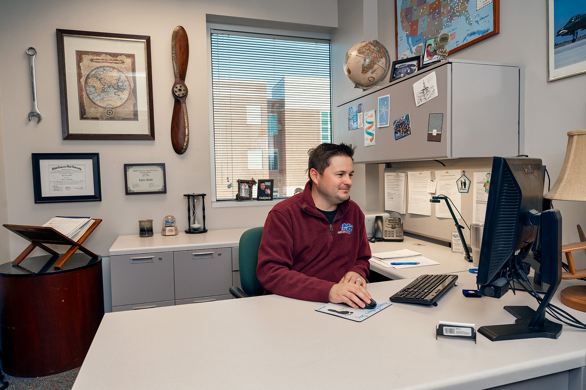 Tyler Babb, Professional Pilot Concentration Coordinator, Aerospace faculty in and around the Business and Aerospace Building. (Photo: Andy Heidt)