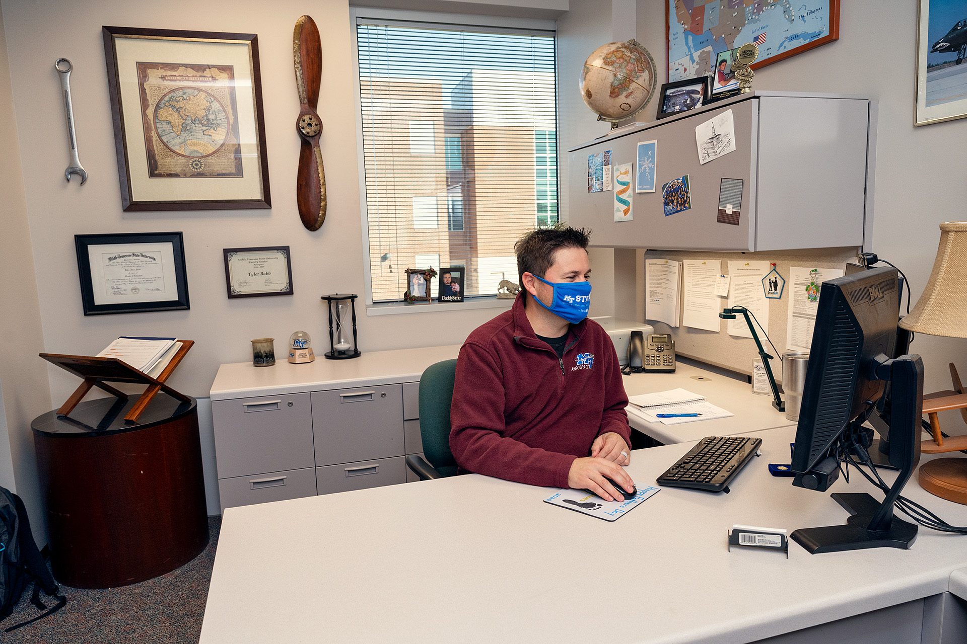 Tyler Babb, Professional Pilot Concentration Coordinator, Aerospace faculty in and around the Business and Aerospace Building. (Photo: Andy Heidt)