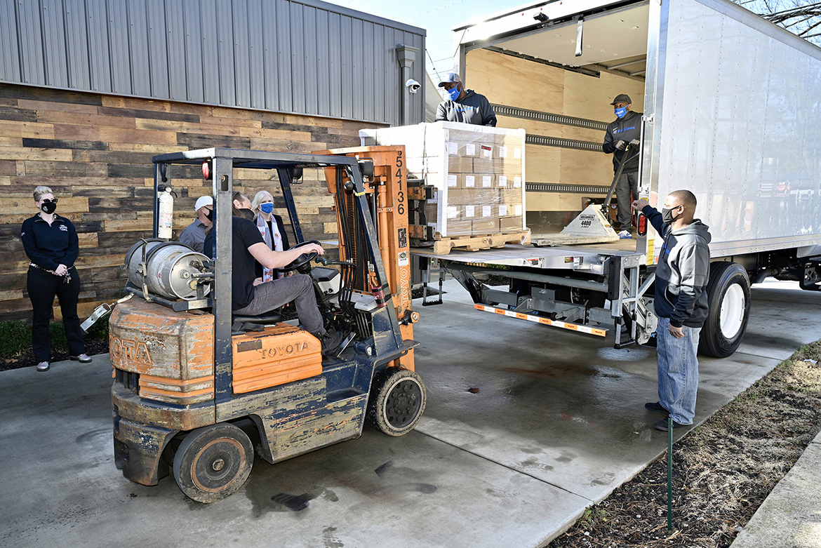 A pallet of 6,000 personal-sized bottles of Lightning Hand Sanitizer is being loaded Friday, Jan. 15, onto a Middle Tennessee State University truck by Big Machine Vodka for delivery from the distillery’s Nashville, Tenn., location to MTSU. The university contracted with Big Machine to acquire sanitizer for students living in on-campus residence halls. (MTSU photo by Andy Heidt)