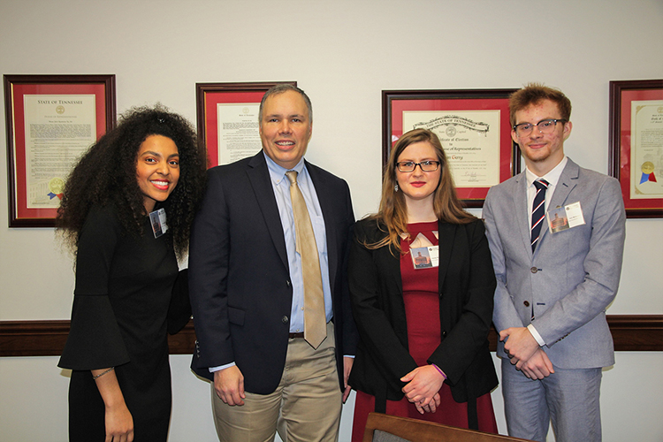 Middle Tennessee State University students Tia Shutes, left, Kayley Stallings, center, and Aric Moilanen, right, pose with Tennessee state Rep. Bryan Terry at the Posters at the Capitol event in February 2020 at the Cordell Hull Building in Nashville, Tenn. The students were participants in the university’s Undergraduate Research Experience and Creative Activity grant program. (MTSU photo by Casey Penston)
