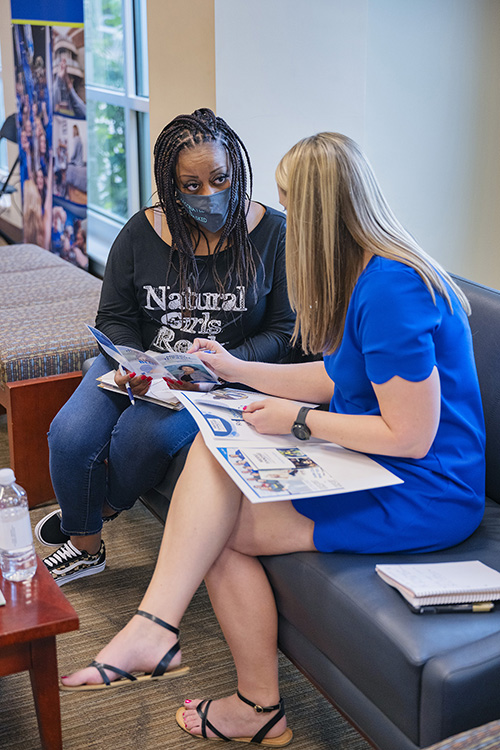 In this file photo, Danielle Fowler, right, coordinator for recruitment and corporate outreach for MTSU University College, talks to a prospective student at a “Finish Your Degree” Q&A event held at Rutherford County Chamber of Commerce in Murfreesboro, Tenn. MTSU is hosting another event on June 17 in Mt. Juliet. (MTSU file photo by Cat Curtis Murphy)