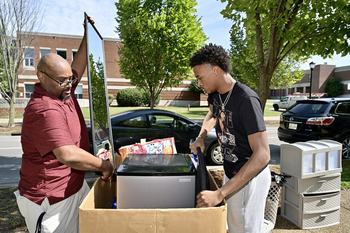 Jarrold Tatum, left, of Cane Ridge, Tenn., places a mirror into a large box and son Justin Tatum adds another item during the new MTSU student’s move in to Corlew Hall Wednesday, Aug. 18. Students continue moving in to campus housing during designated times through Saturday afternoon. Nearly 3,000 students will be in university housing this fall. (MTSU photo by Andy Heidt)