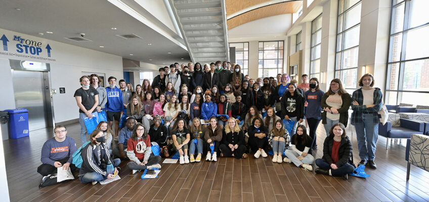Some 70 students from Blackman Collegiate Academy pose for a group photo on the first floor of the MT One Stop during their Oct. 21 tour of MTSU. (MTSU photo by Andy Heidt)