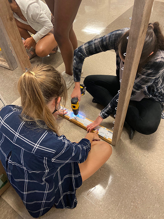 MTSU interior design majors work to construct a Japanese tangram puzzle near the intersection of Second and Broadway in Nashville. The students' project was awarded the "Best Overall" prize by the Nashville Civic Design Center in the Sept. 21 Park(ing) Day competition. (MTSU photo by James Cessna)