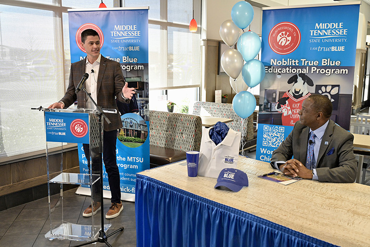 MTSU President Sidney A. McPhee, right, listens to remarks from Beau Noblitt, restaurant operator for Chick-fil-A Murfreesboro, before they signed an agreement Wednesday, Jan. 12, at the fast-food chain’s Memorial Boulevard location that provides tuition assistance for qualifying local Chick-fil-A employees. (MTSU photo by Andy Heidt)