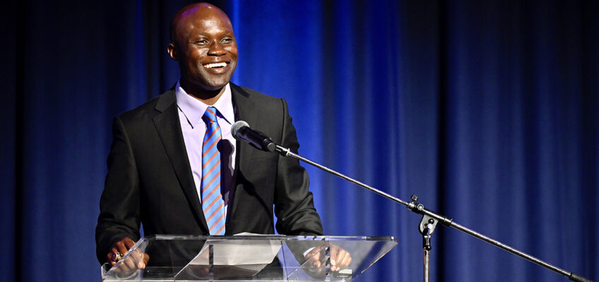 Dr. Andrew Owusu, a professor of health and human performance, addresses an audience after being formally announced as the 2022 recipient of the John Pleas Faculty Award in a Feb. 23 ceremony at the James Union Building at Middle Tennessee State University. (MTSU photo by Cat Curtis Murphy)