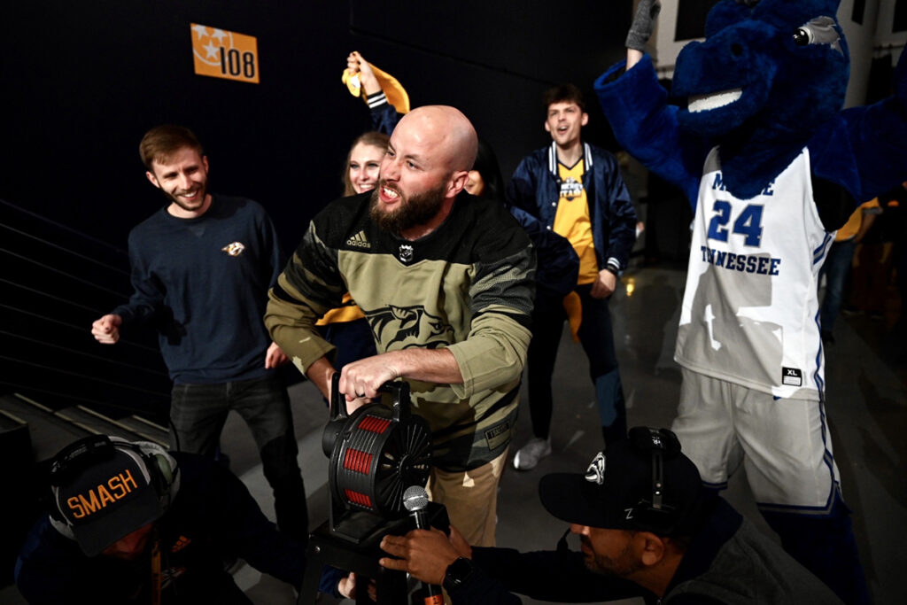 MTSU senior aerospace professional pilot major Orrin Farmer relishes his role as Predators fan captain during the second intermission, creating noise to help thousands of fans become louder. The Preds responded with two third period goals to defeat Dallas 2-1 in Bridgestone Arena on Tuesday, March 8. (MTSU photo by James Cessna)