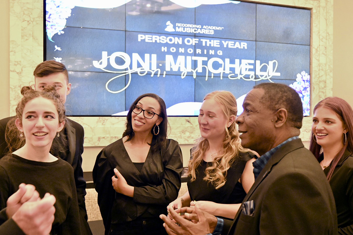 MTSU President Sidney A. McPhee, second from right, chats with students and recent alumni from the university’s College of Media and Entertainment before Friday night’s MusiCares fundraiser at the site of the 2022 Grammy Awards in Las Vegas (MTSU Photo by Andrew Oppmann).