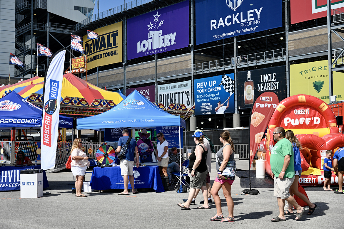Fans attending the Rackley Roofing 200 NASCAR Camping World Truck Series event Friday, June 24, at Nashville Superspeedway in Gladeville, Tenn., approach the MTSU Charlie and Hazel Daniels Veterans and Military Family Center. The Daniels Center has partnerships with Rackley Roofing and Nashville Superspeedway. (MTSU photo by J. Intintoli)